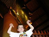 Bangkok 03 03 Wat Po Temple of the Reclining Buddha Peter Pete and I doubled back and bought 108 small 1-satang coins and dropped them in the 108 bronze bowls. This corresponds to the 108 auspicious characteristics of the Buddha -- for good fortune and to help the monks keep up the wat.